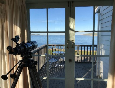 <p>Telescope looking out onto deck and the estuary beyond.</p>